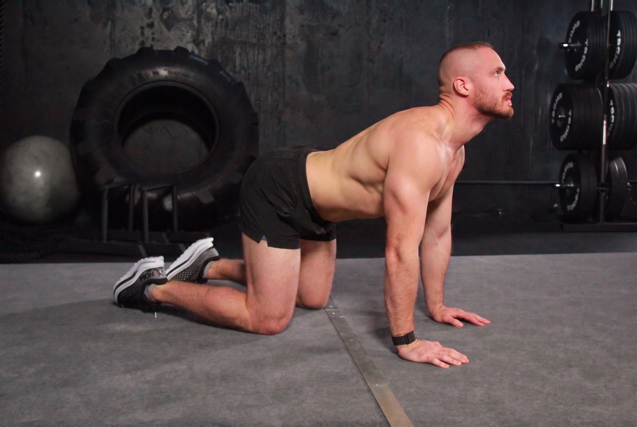 Cow position — back arched low, chest and eyes lifted, shoulder blades pinched